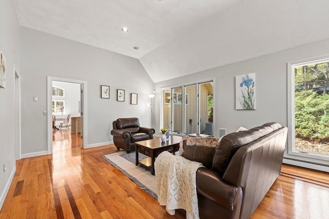 living room with light wood-style flooring, visible vents, vaulted ceiling, baseboard heating, and baseboards