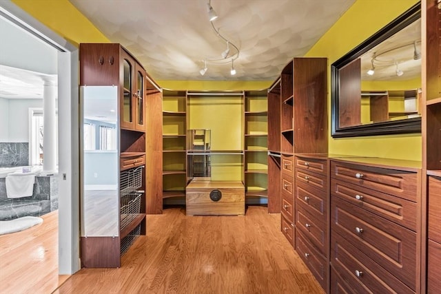 spacious closet featuring wood finished floors