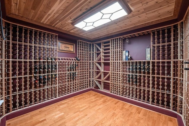 wine cellar featuring wooden ceiling and wood finished floors