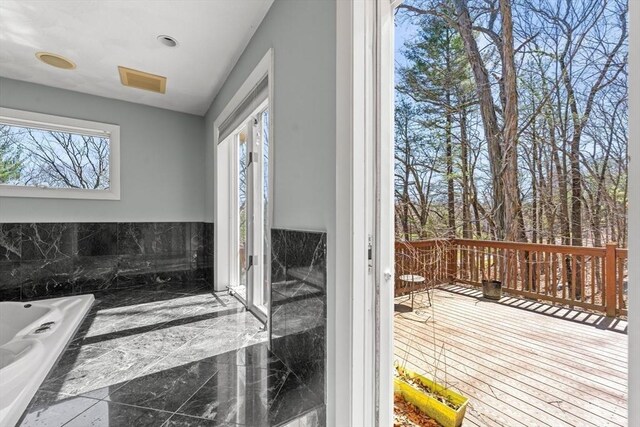 full bath with a bathtub, visible vents, and marble finish floor