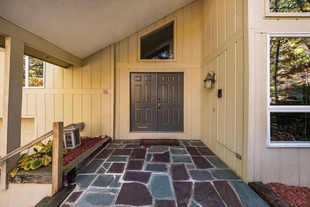 doorway to property with board and batten siding