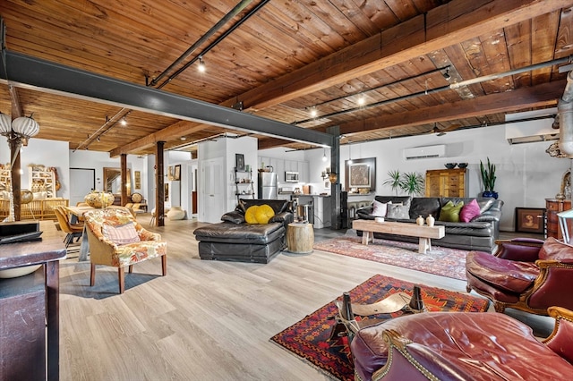 living room featuring beamed ceiling, light hardwood / wood-style flooring, and wooden ceiling