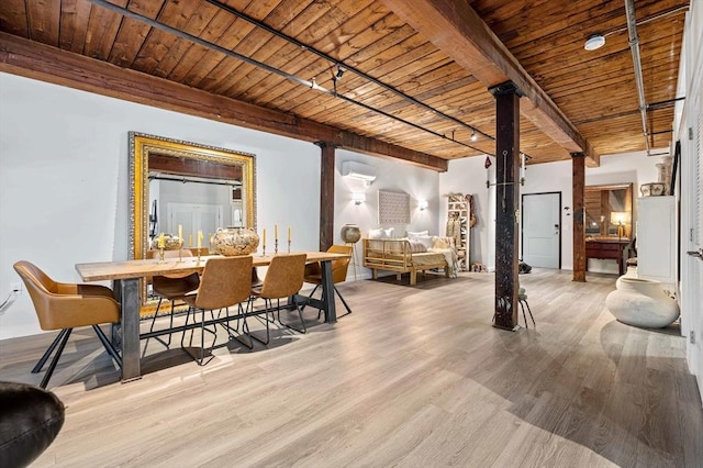 dining space with beamed ceiling, decorative columns, wooden ceiling, and wood finished floors