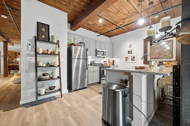 kitchen featuring appliances with stainless steel finishes, light stone counters, light wood-style floors, and wood ceiling
