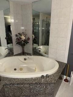 100 E 6th St Unit 2, Dracut, MA 01826 - bathroom with a shower stall and a whirlpool tub