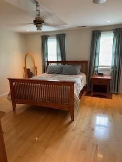100 E 6th St Unit 2, Dracut, MA 01826 - bedroom with multiple windows, wood finished floors, and a ceiling fan
