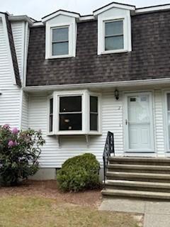 100 E 6th St Unit 2, Dracut, MA 01826 - view of front of home featuring roof with shingles
