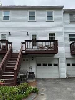 100 E 6th St Unit 2, Dracut, MA 01826 - rear view of property with an attached garage, driveway, and stairway