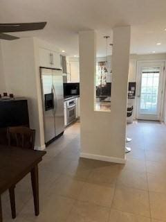 100 E 6th St Unit 2, Dracut, MA 01826 - kitchen featuring stainless steel appliances, white cabinets, light tile patterned floors, recessed lighting, and baseboards