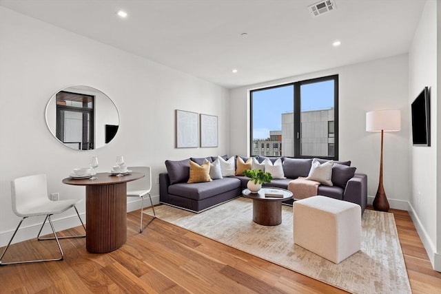 1515 Commonwealth Ave Unit 314, Boston, MA 02135 - living area featuring wood finished floors and recessed lighting