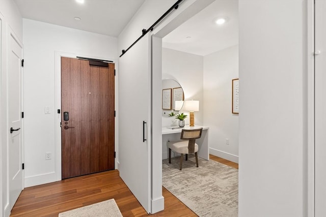 1515 Commonwealth Ave Unit 314, Boston, MA 02135 - foyer featuring a barn door, wood finished floors, and recessed lighting