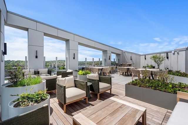 1515 Commonwealth Ave Unit 314, Boston, MA 02135 - wooden deck with outdoor dining area