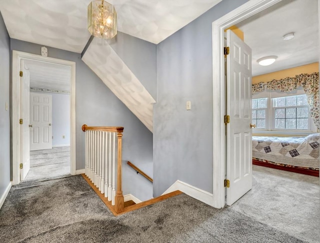 interior space with baseboards and carpet floors