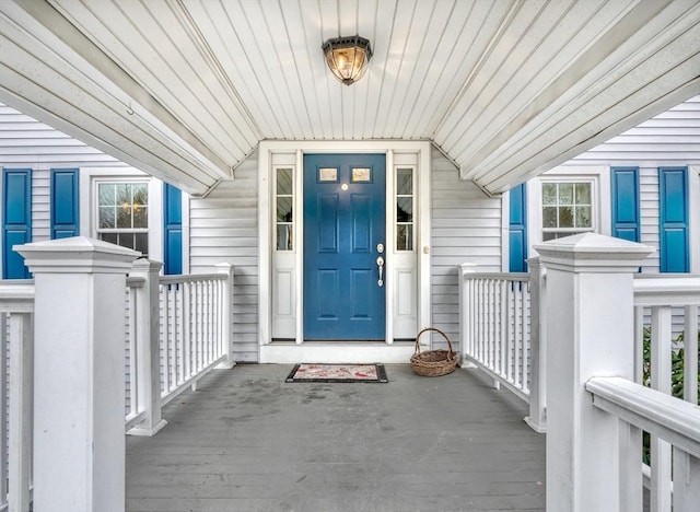 view of exterior entry with covered porch