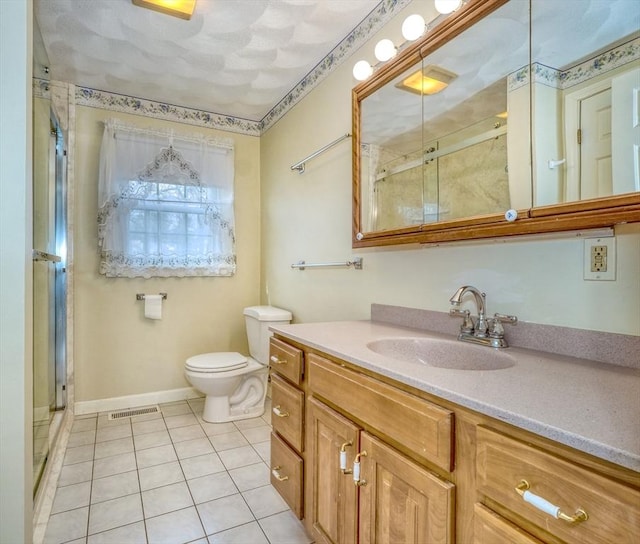 bathroom featuring visible vents, toilet, a shower stall, tile patterned flooring, and vanity