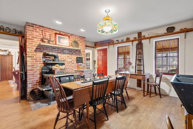 dining space with light hardwood / wood-style floors