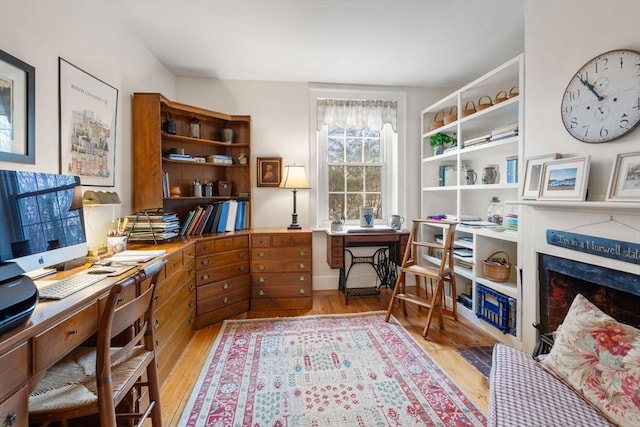 office space with light hardwood / wood-style flooring