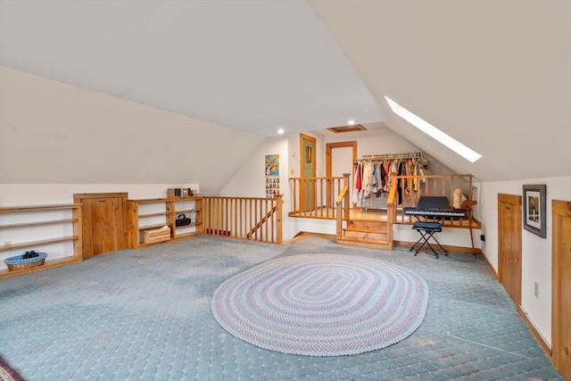 additional living space featuring carpet and vaulted ceiling with skylight