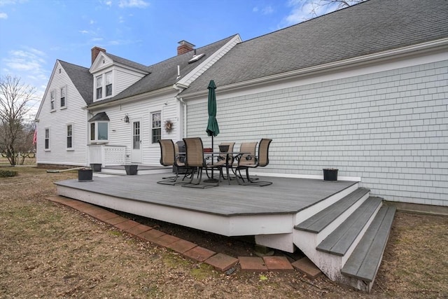 rear view of house featuring a deck