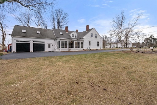 back of property featuring a lawn