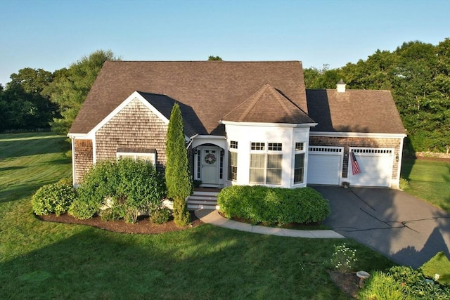 75 Country Way Unit 75, Dartmouth, MA 02748 - view of front of home with a garage, driveway, a front lawn, and a shingled roof