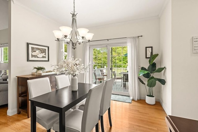 75 Country Way Unit 75, Dartmouth, MA 02748 - dining area with crown molding, a chandelier, plenty of natural light, and light wood-style flooring