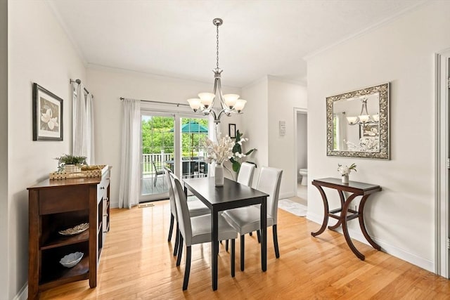 75 Country Way Unit 75, Dartmouth, MA 02748 - dining area featuring a chandelier, light wood-style flooring, and ornamental molding