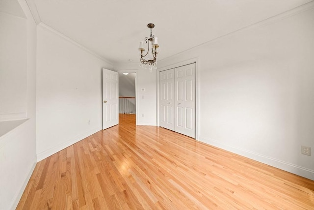 75 Country Way Unit 75, Dartmouth, MA 02748 - unfurnished room with a chandelier, crown molding, and light wood finished floors