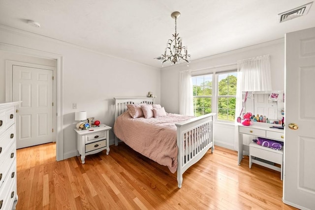 75 Country Way Unit 75, Dartmouth, MA 02748 - bedroom with a chandelier, light wood finished floors, and crown molding
