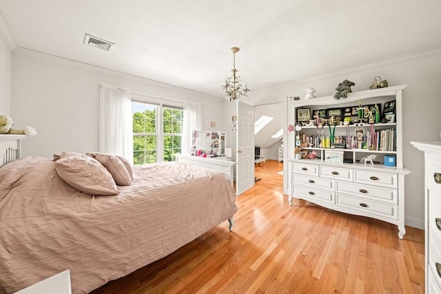 75 Country Way Unit 75, Dartmouth, MA 02748 - bedroom with light wood-type flooring, ornamental molding, and a chandelier