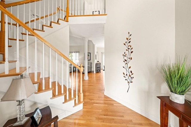 75 Country Way Unit 75, Dartmouth, MA 02748 - foyer featuring wood finished floors, stairway, and decorative columns