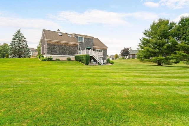 75 Country Way Unit 75, Dartmouth, MA 02748 - back of property with stairway, a lawn, and a wooden deck