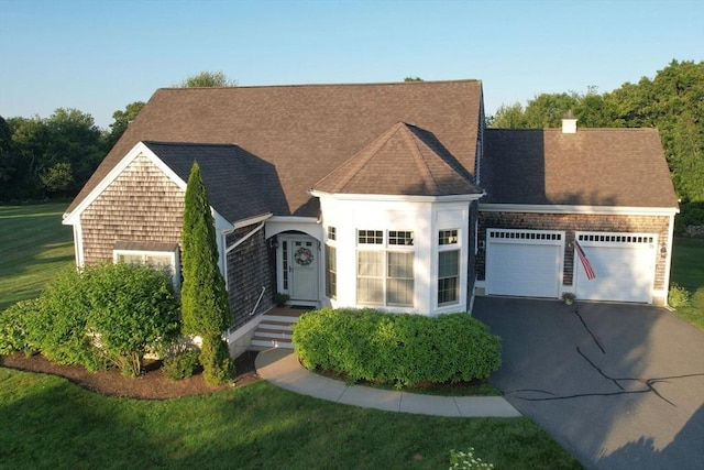 75 Country Way Unit 75, Dartmouth, MA 02748 - view of front of home with a garage, asphalt driveway, a front lawn, and a shingled roof