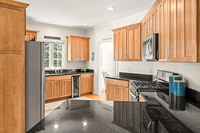 75 Country Way Unit 75, Dartmouth, MA 02748 - kitchen featuring stainless steel appliances, wine cooler, dark stone counters, crown molding, and light wood-style flooring