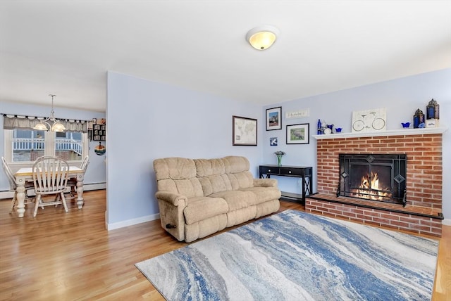 living room featuring hardwood / wood-style floors and a fireplace