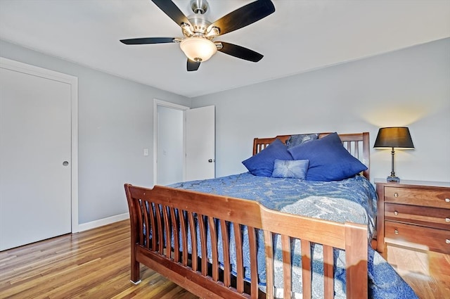 bedroom featuring light hardwood / wood-style floors and ceiling fan