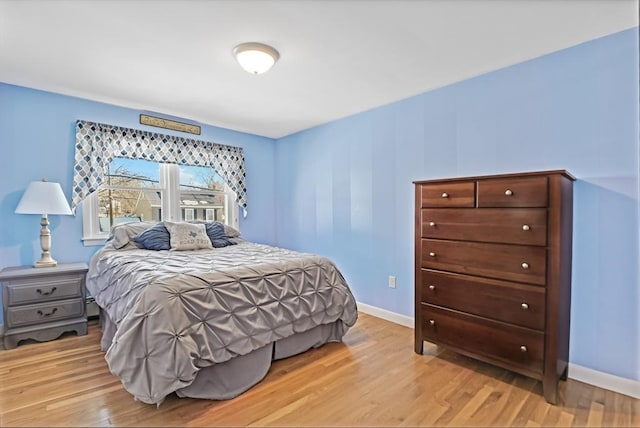 bedroom featuring light wood-type flooring