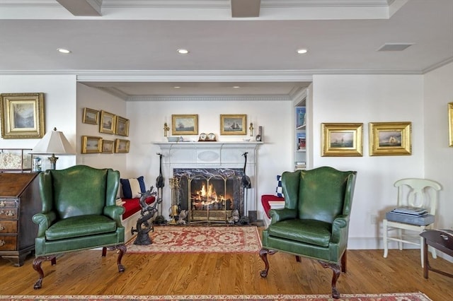 3 Anchorage Ln, Marblehead, MA 01945 - sitting room featuring wood finished floors, crown molding, a warm lit fireplace, and recessed lighting