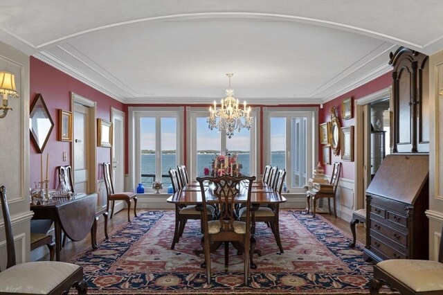3 Anchorage Ln, Marblehead, MA 01945 - dining space with wood finished floors, a chandelier, a water view, and ornamental molding