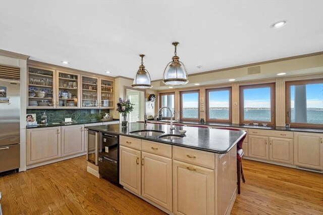 3 Anchorage Ln, Marblehead, MA 01945 - kitchen with a sink, built in fridge, light brown cabinetry, a center island with sink, and decorative backsplash
