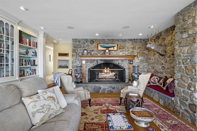 3 Anchorage Ln, Marblehead, MA 01945 - living room with a stone fireplace, crown molding, and recessed lighting