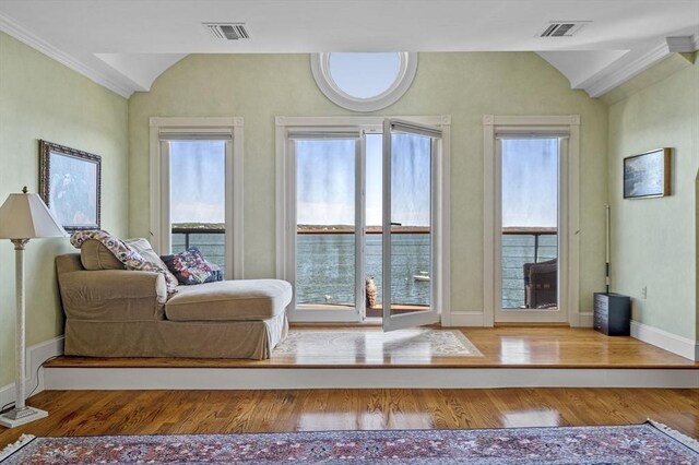 3 Anchorage Ln, Marblehead, MA 01945 - sitting room with lofted ceiling, wood finished floors, baseboards, and ornamental molding