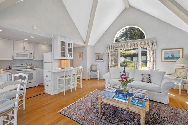 3 Anchorage Ln, Marblehead, MA 01945 - living room with high vaulted ceiling, light wood-style floors, beamed ceiling, baseboards, and recessed lighting