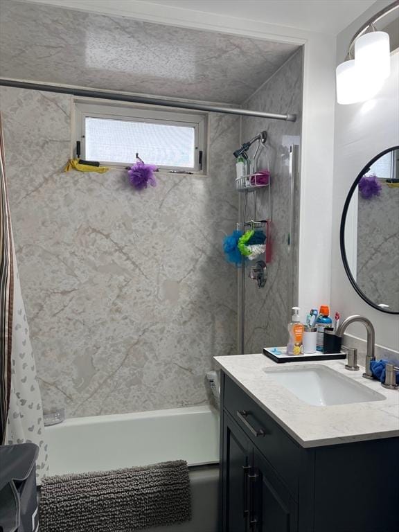 bathroom featuring vanity and shower / bath combo with shower curtain