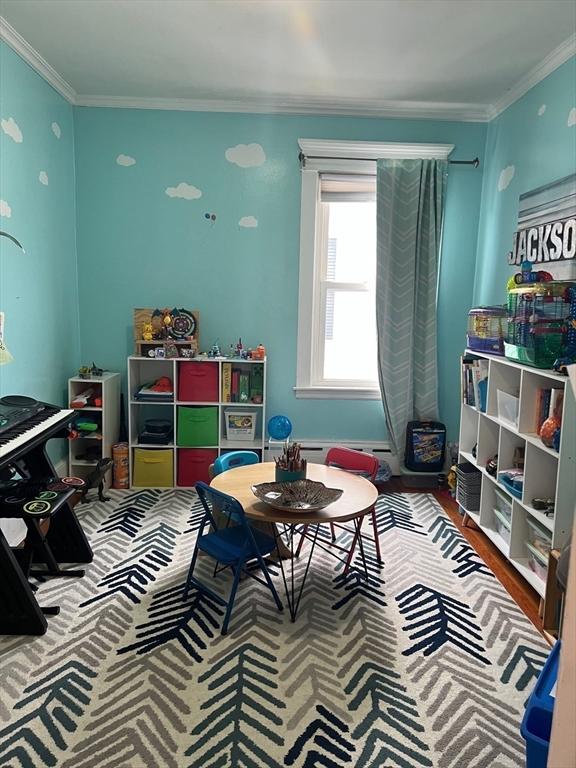 game room featuring crown molding