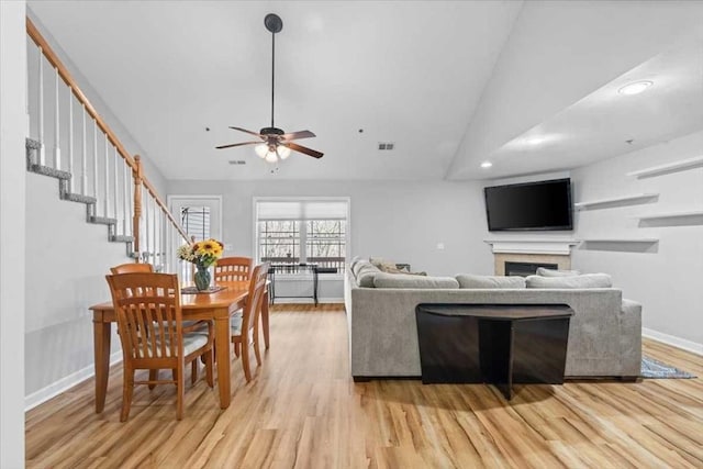 216 Reservoir St Unit 304, Holden, MA 01520 - living room featuring visible vents, baseboards, a fireplace, ceiling fan, and light wood-style floors
