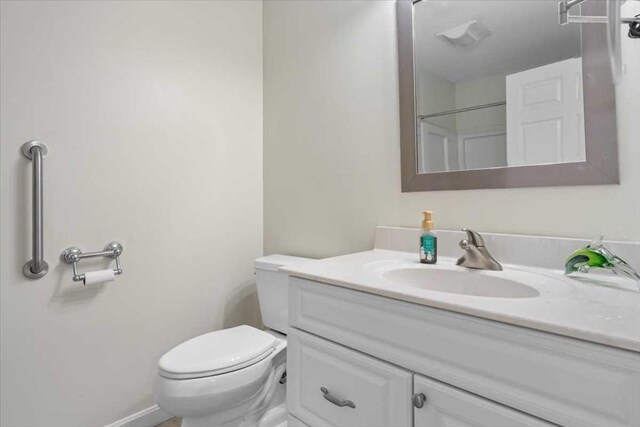 216 Reservoir St Unit 304, Holden, MA 01520 - bathroom featuring baseboards, toilet, and vanity