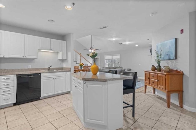 216 Reservoir St Unit 304, Holden, MA 01520 - kitchen with white cabinetry, a breakfast bar area, a center island, dishwasher, and a ceiling fan