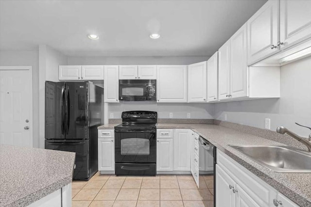 216 Reservoir St Unit 304, Holden, MA 01520 - kitchen with white cabinetry, a sink, and black appliances