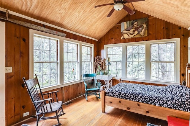50 Higgins Ln, Wellfleet, MA 02667 - bedroom featuring wood walls, multiple windows, lofted ceiling, wood ceiling, and light wood-type flooring